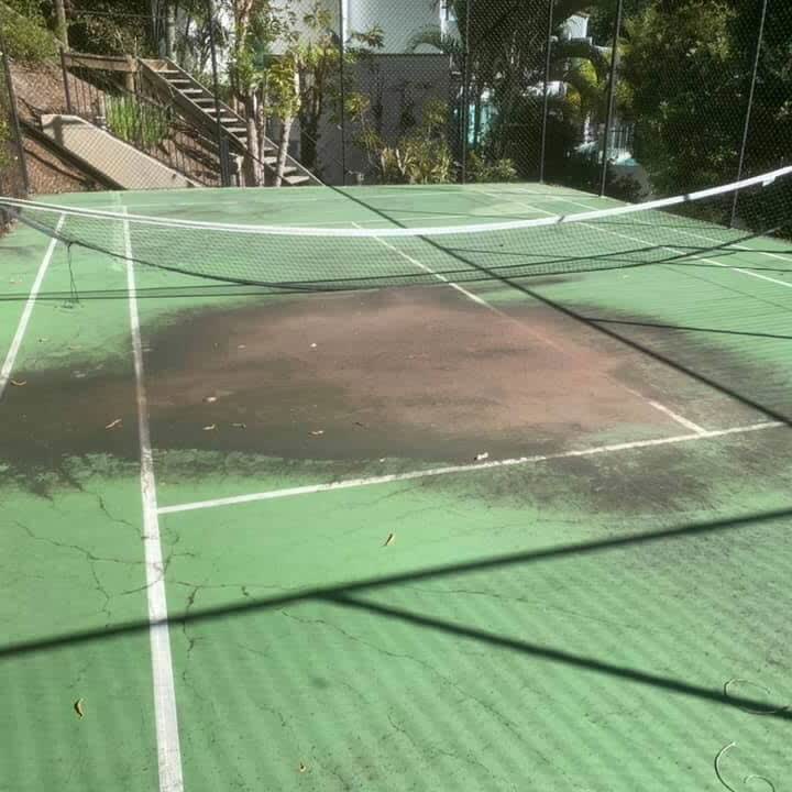 Tennis court cleaning — before