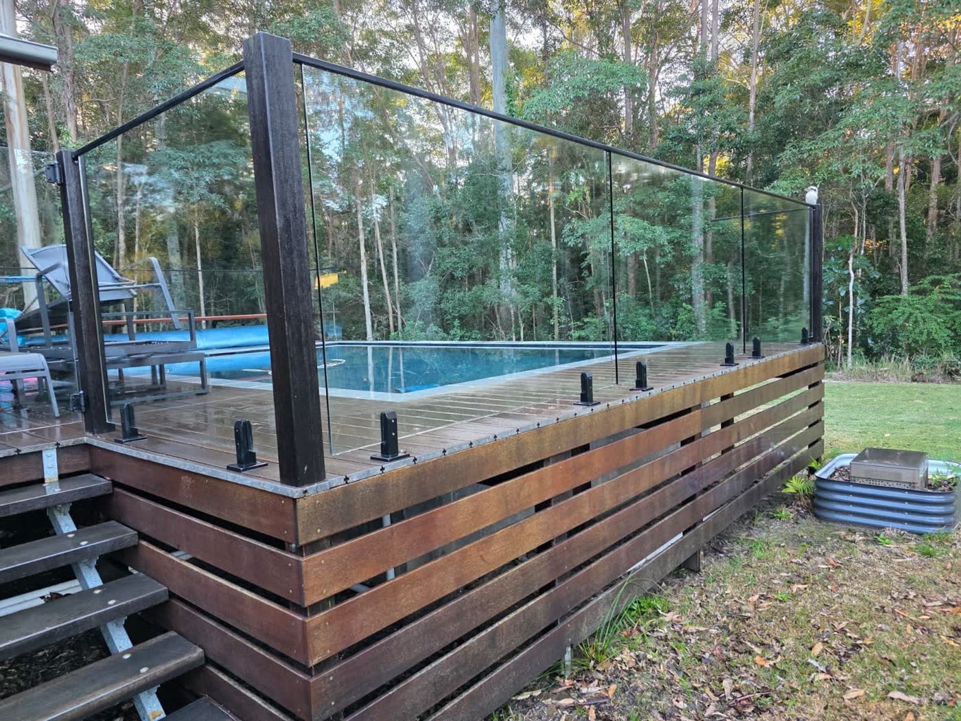 Glass pool fence and timber deck crystal clear after genuine soft washing